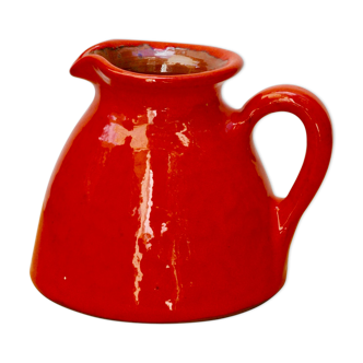 Orange earthen glazed pitcher
