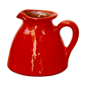 Orange earthen glazed pitcher