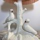 Ceramic lamp with birds, pink fringed shade, 1950s.