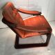 Duo of ochre leather and wood frame armchairs