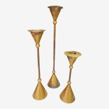 Trio of brass candlesticks design year 70