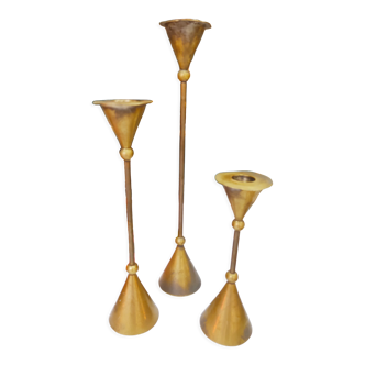 Trio of brass candlesticks design year 70