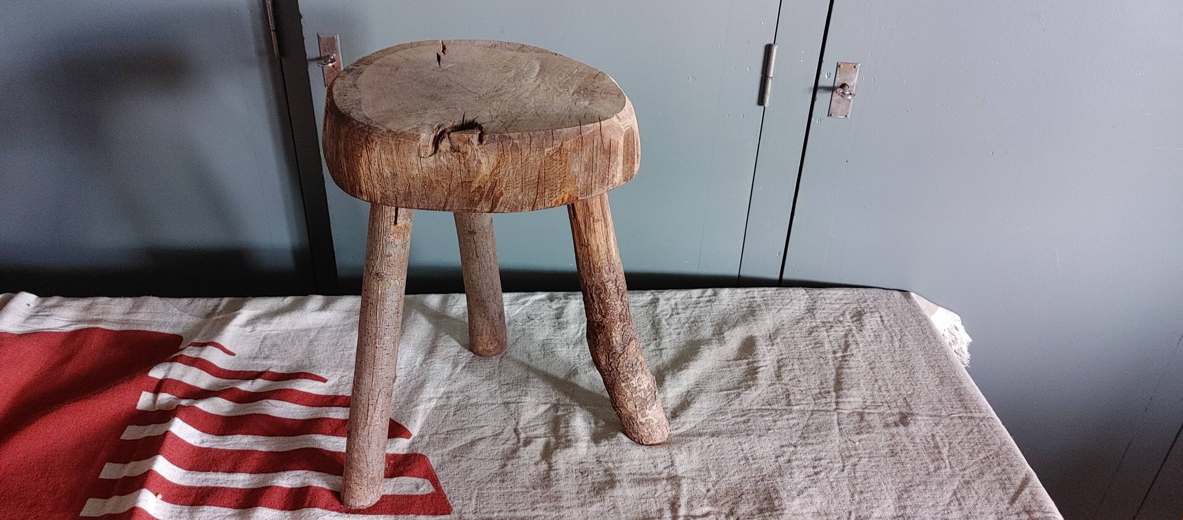 Old small country stool in raw wood - tripod base