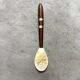 Mother-of-pearl and wood spoon