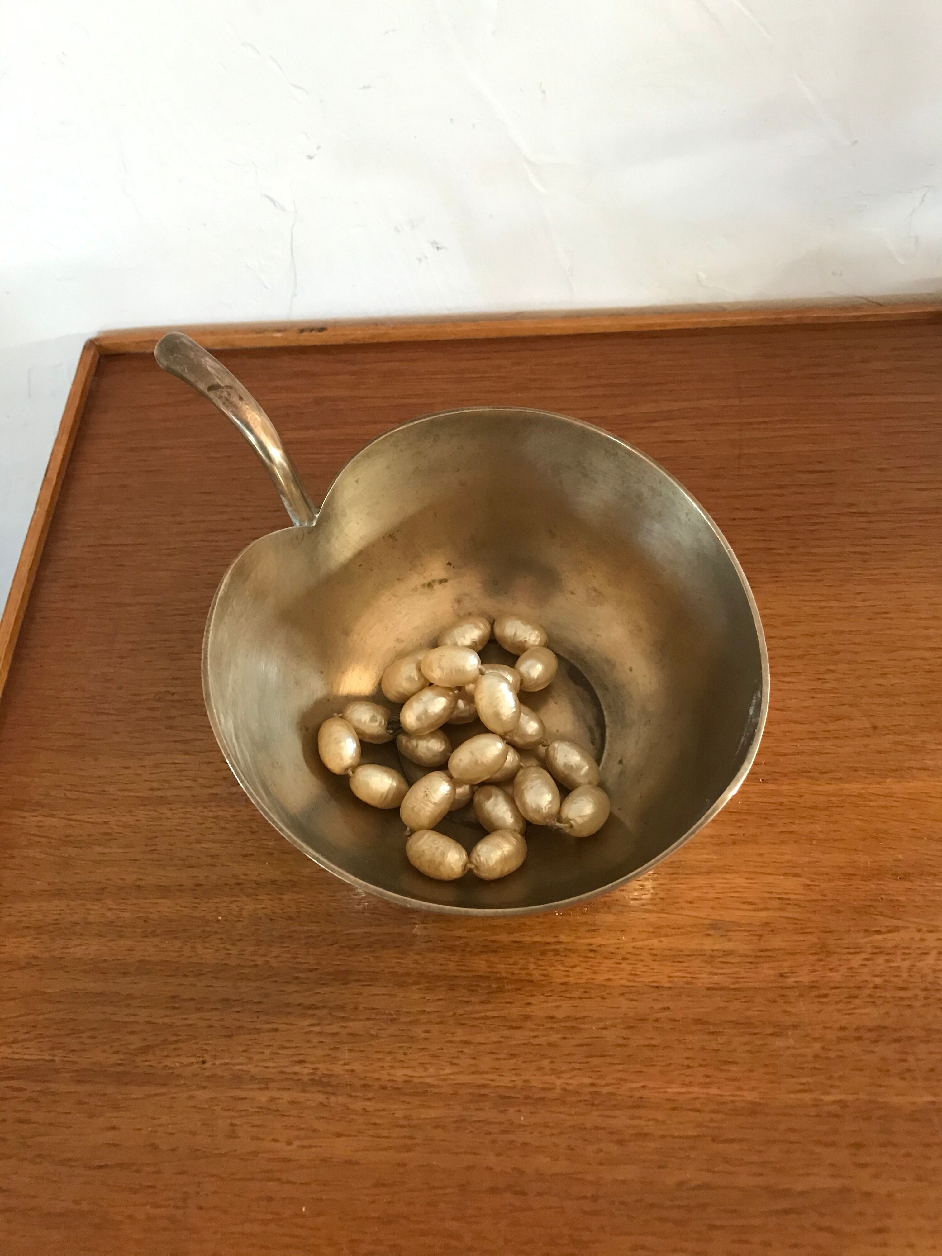 Empty brass apple pocket