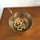 Empty brass apple pocket