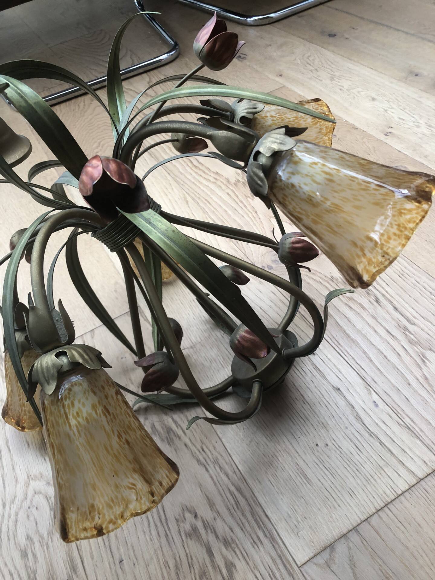 Antique Art Deco metal chandelier with a tinted glass shade.