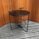 1950s round coffee table in black opaline