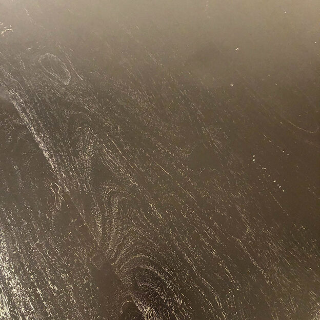 Table circulaire en bois noirci, pied central balustre