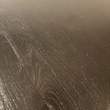 Circular table in blackened wood, central baluster leg