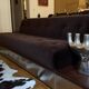 Red Edition Stanley 3-seater sofa with matching chocolate velvet storage.