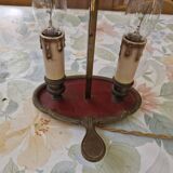 Old silver-plated bronze lamp, except for the arms which are not silver.