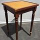 Pair of small flying tables dandy wrapped leather and gold vignette