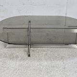 Coffee table with steel base and smoked glass slab. Circa 197