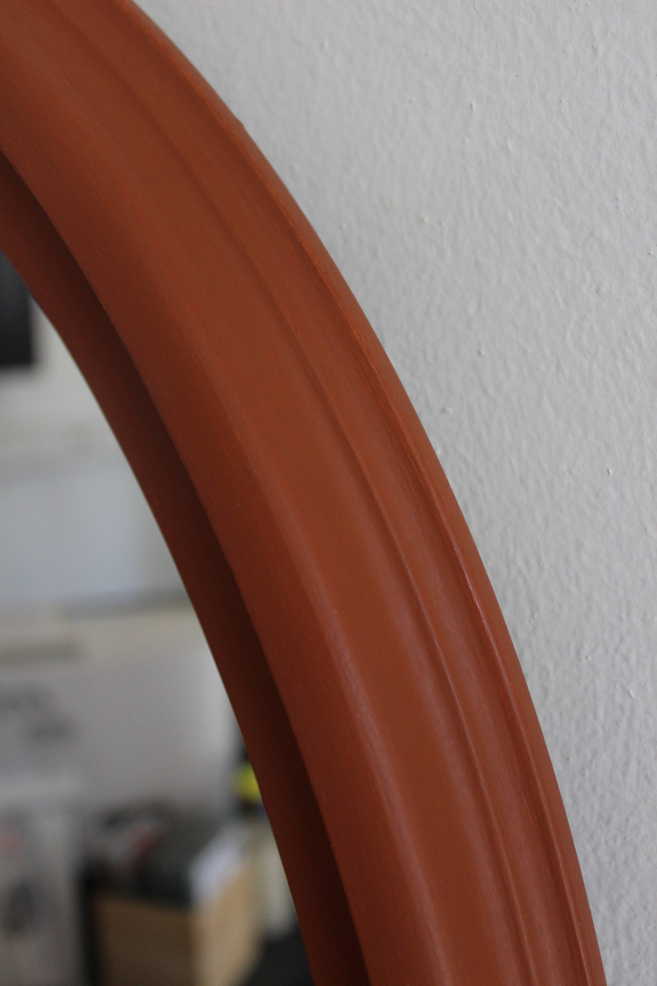 Terracotta patinated oval mirror