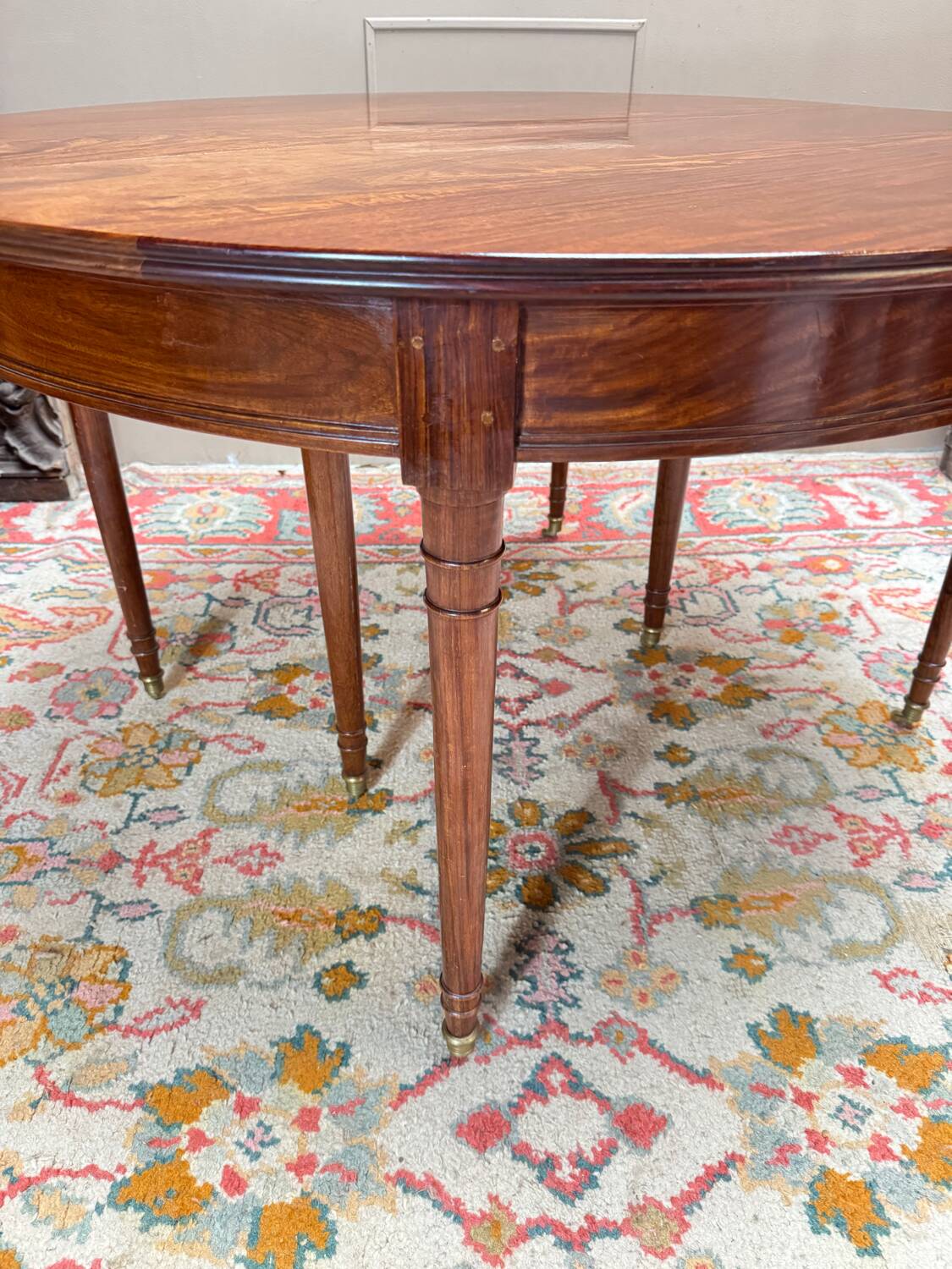 Dining table with a mahogany band in louis xvi style