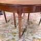 Dining table with a mahogany band in louis xvi style