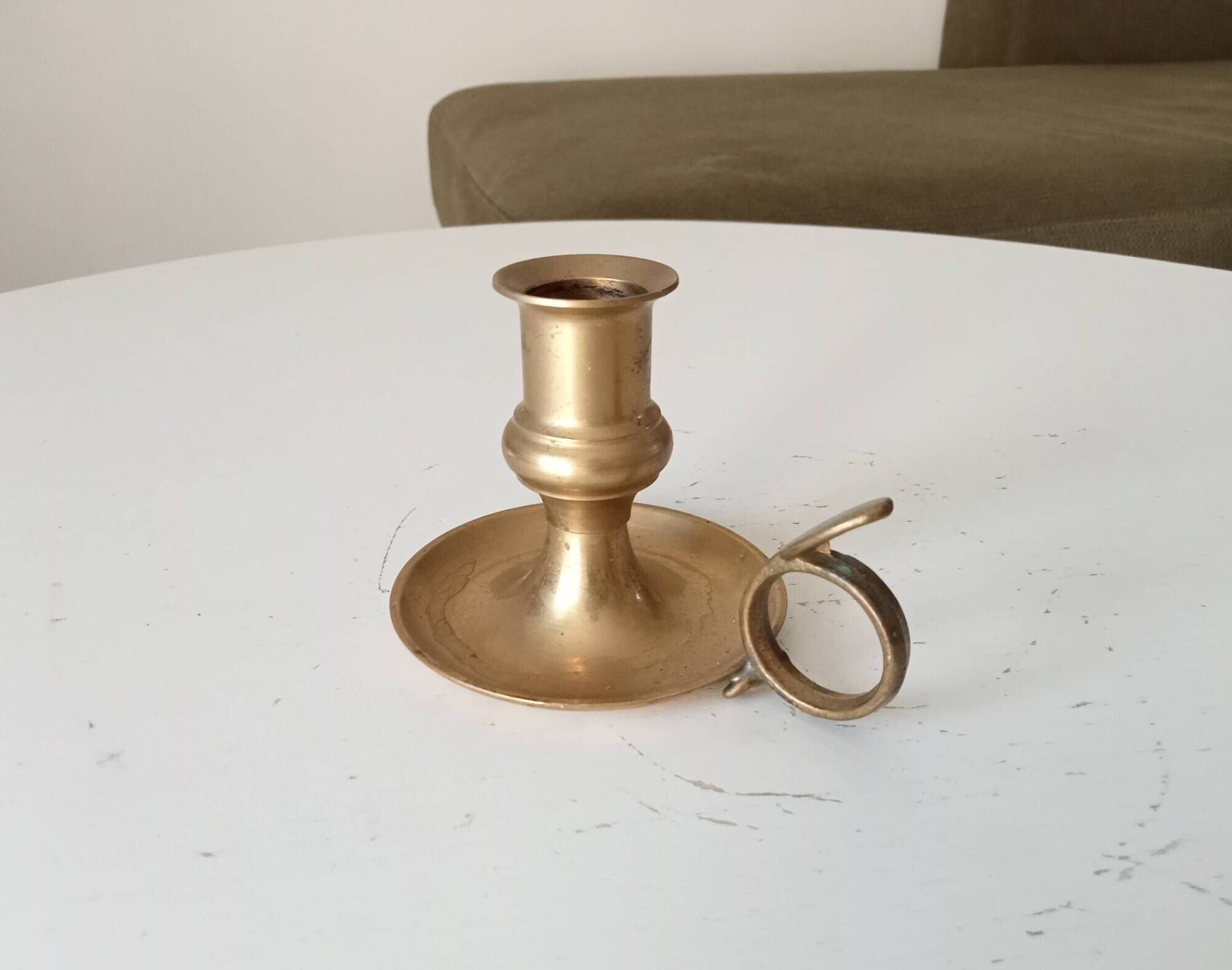Antique hand candlestick in solid gilded brass.