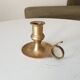 Antique hand candlestick in solid gilded brass.