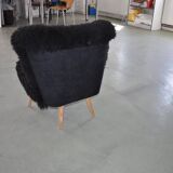 Mid-century black cocktail chair in lambskin, beech legs — 1960s