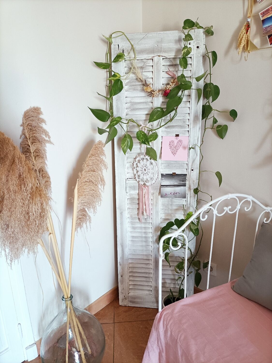 Vintage shutter renovated into a coat rack