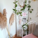 Vintage shutter renovated into a coat rack