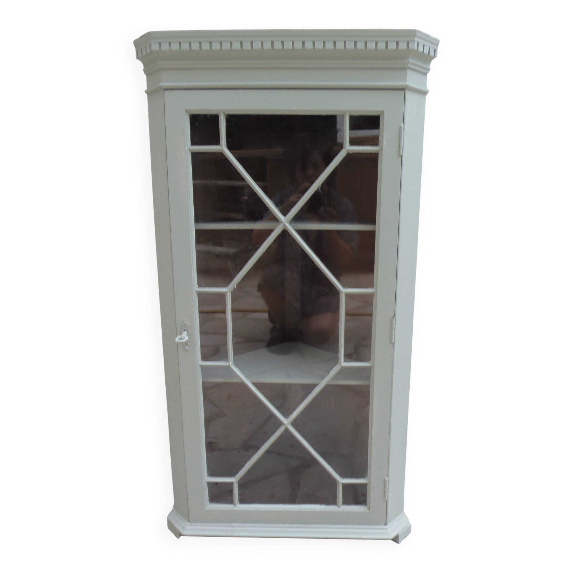 Vintage English corner display cabinet enhanced in grey-green with a wooden top.