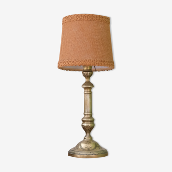 Lamp mounted on a brass candle holder