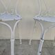 Pair of wrought iron garden chairs, antique manufacture