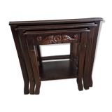 Nested tables made of varnished solid wood.