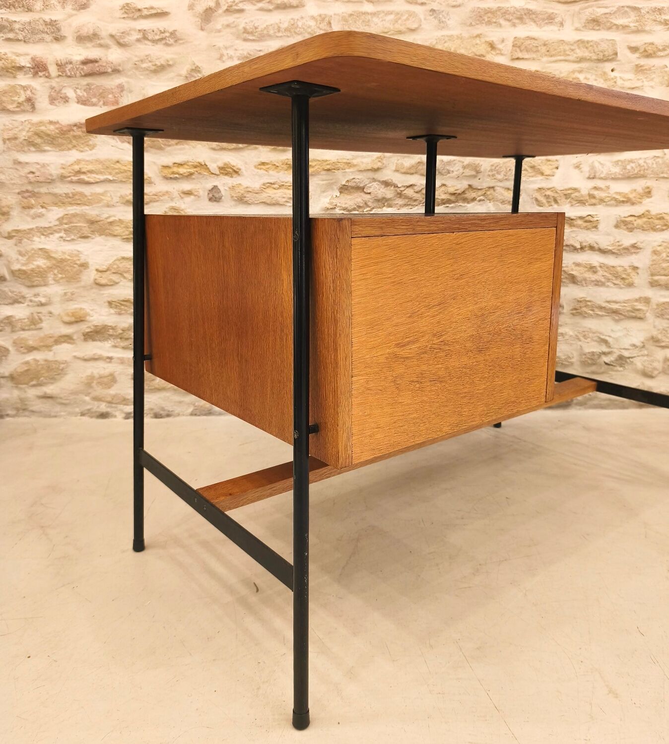 Modernist desk with suspended drawer unit, French work from the 1950s.