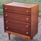 Vintage golden oak chest of drawers with 4 spindle feet from the 1950s
