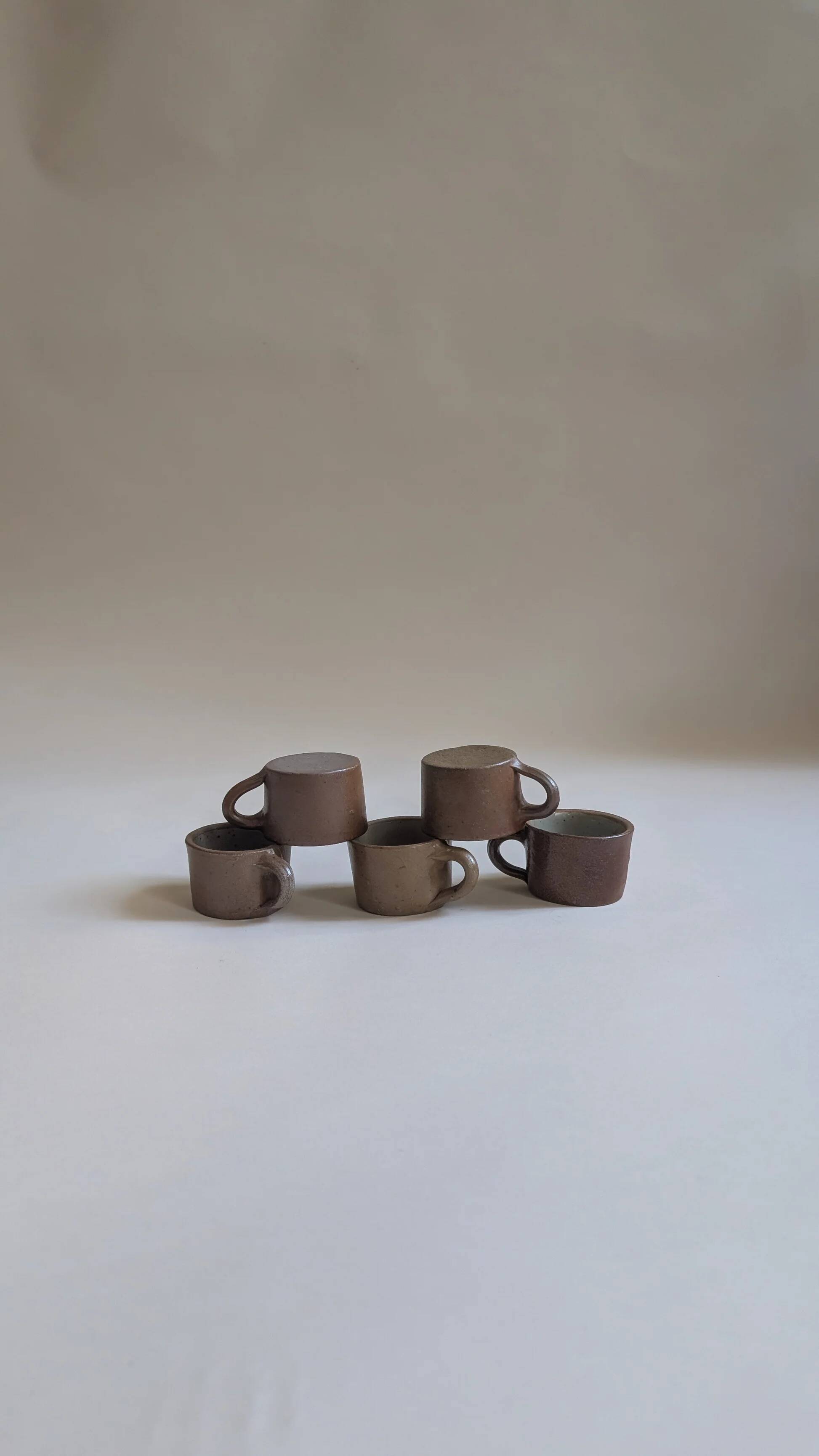Set of 5 brown stoneware cups