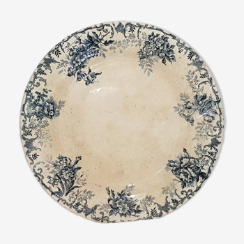 Round dish of the earthenware factory of Choisy le Roi model Floreal, iron earth.