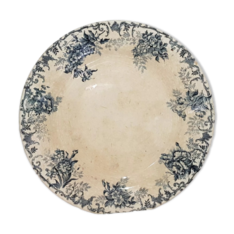 Round dish of the earthenware factory of Choisy le Roi model Floreal, iron earth.