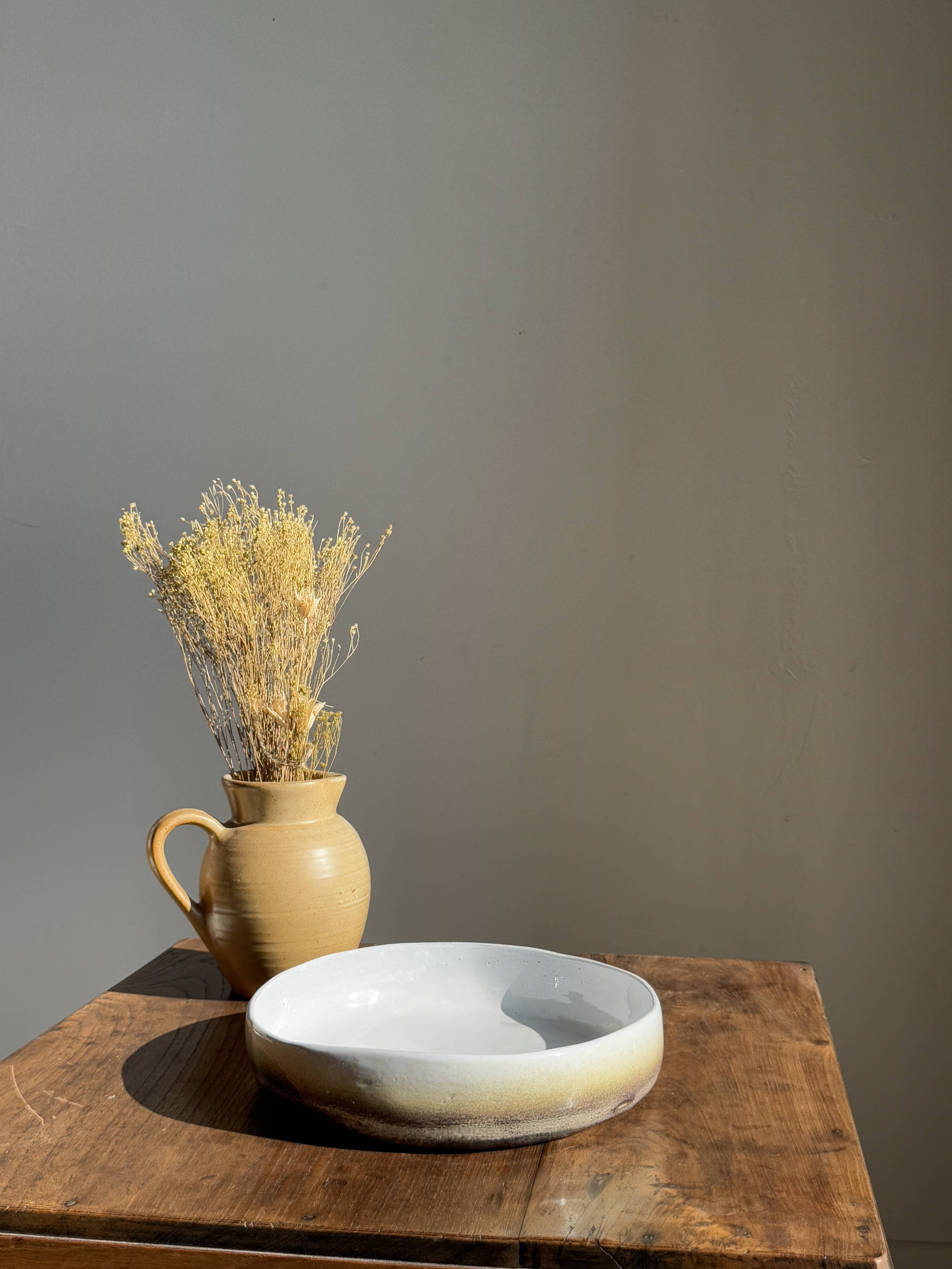 Large white and earthenware ceramic dish