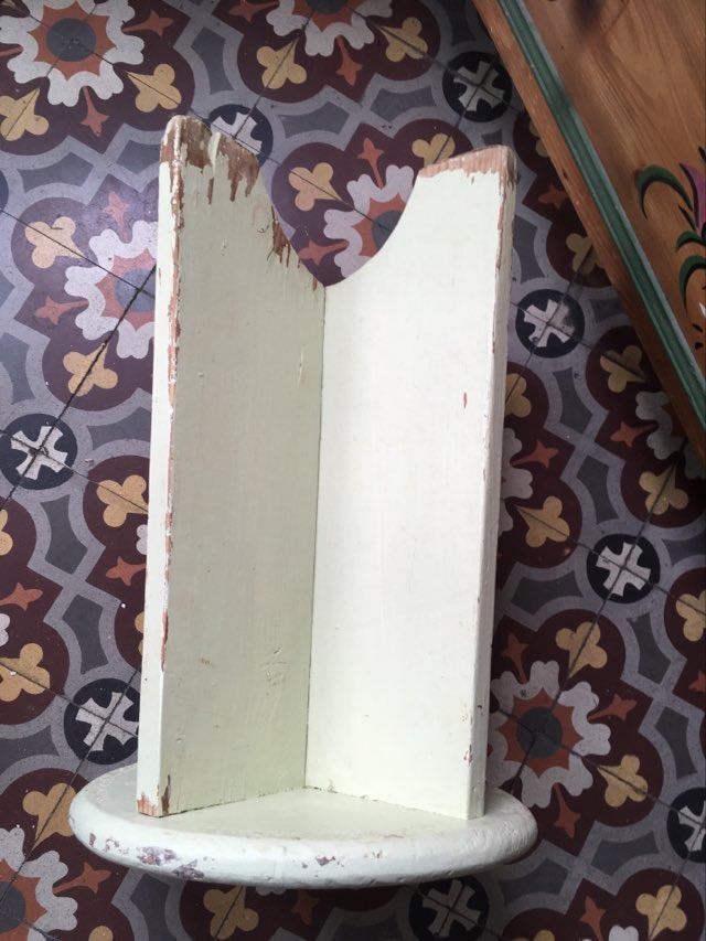 A rough wooden stool patinated by time