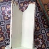 A rough wooden stool patinated by time