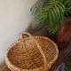 Light wicker oval basket with vintage round handle