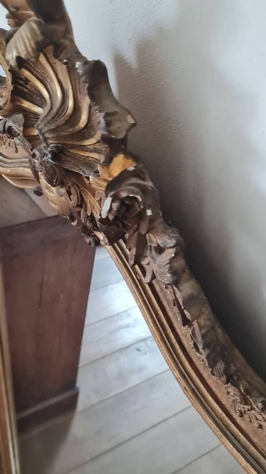 Antique Louis Philippe mirror with a pediment.