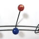 Multicolored wooden and metal coat holder