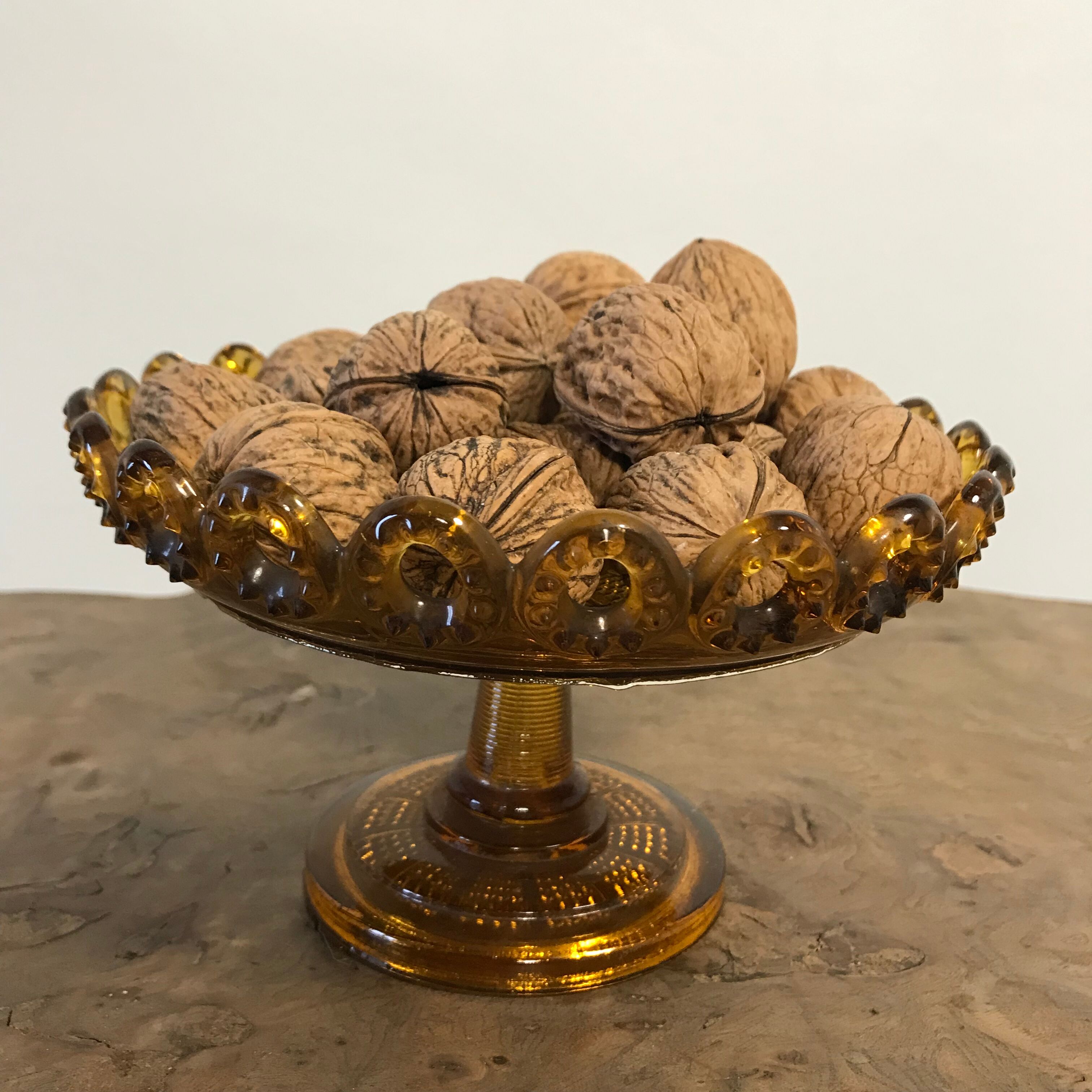 1900 fruit cup in amber pressed glass.