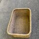 Large basket / rectangular storage bin made of woven natural fibre.