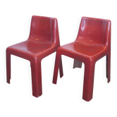 Pair of red fibreglass chairs from the 1970s.
