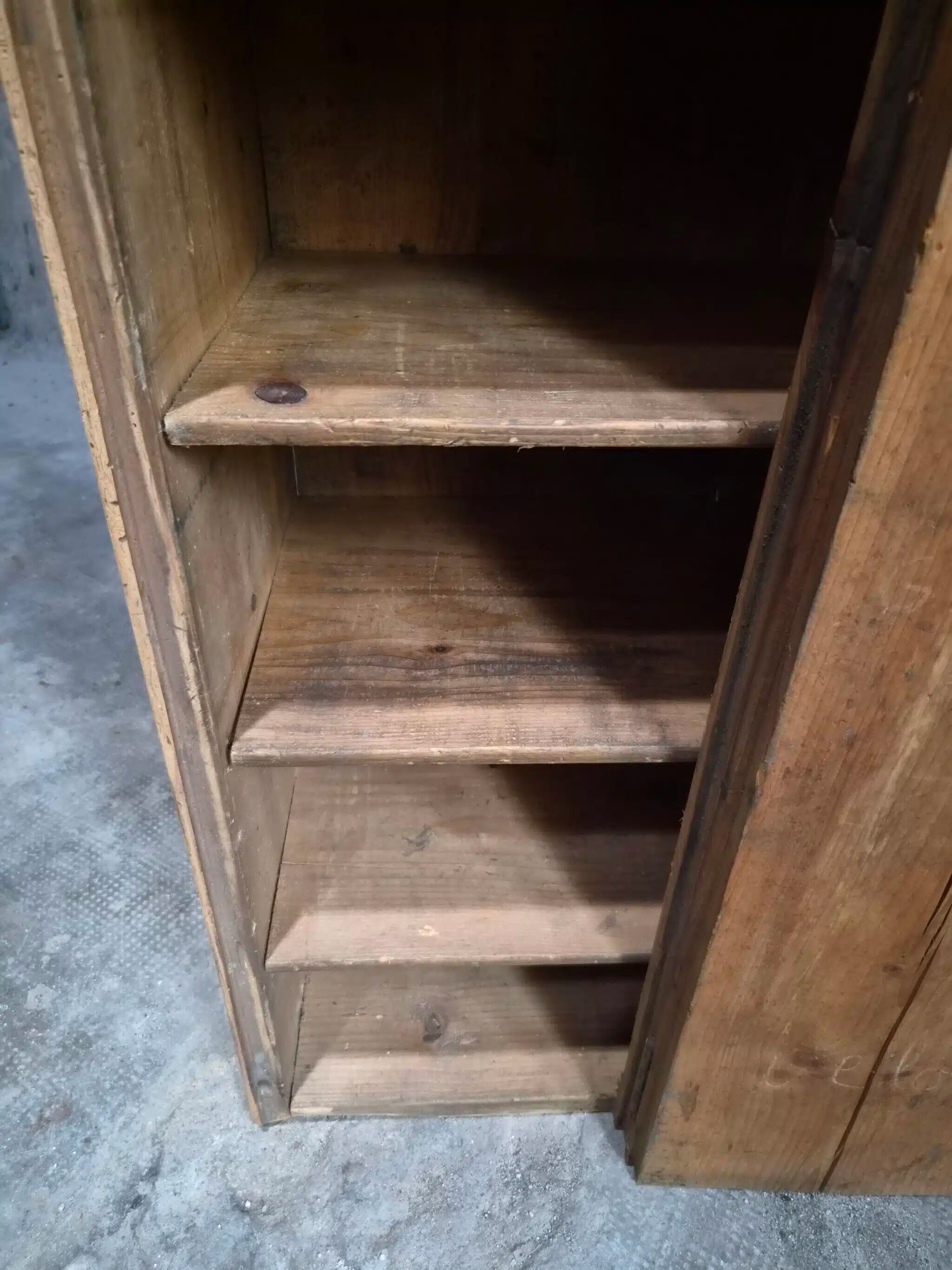 Antique French workshop cabinet in pine with compartments.