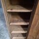Antique French workshop cabinet in pine with compartments.