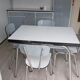 In formica kitchen table with 4 chairs
