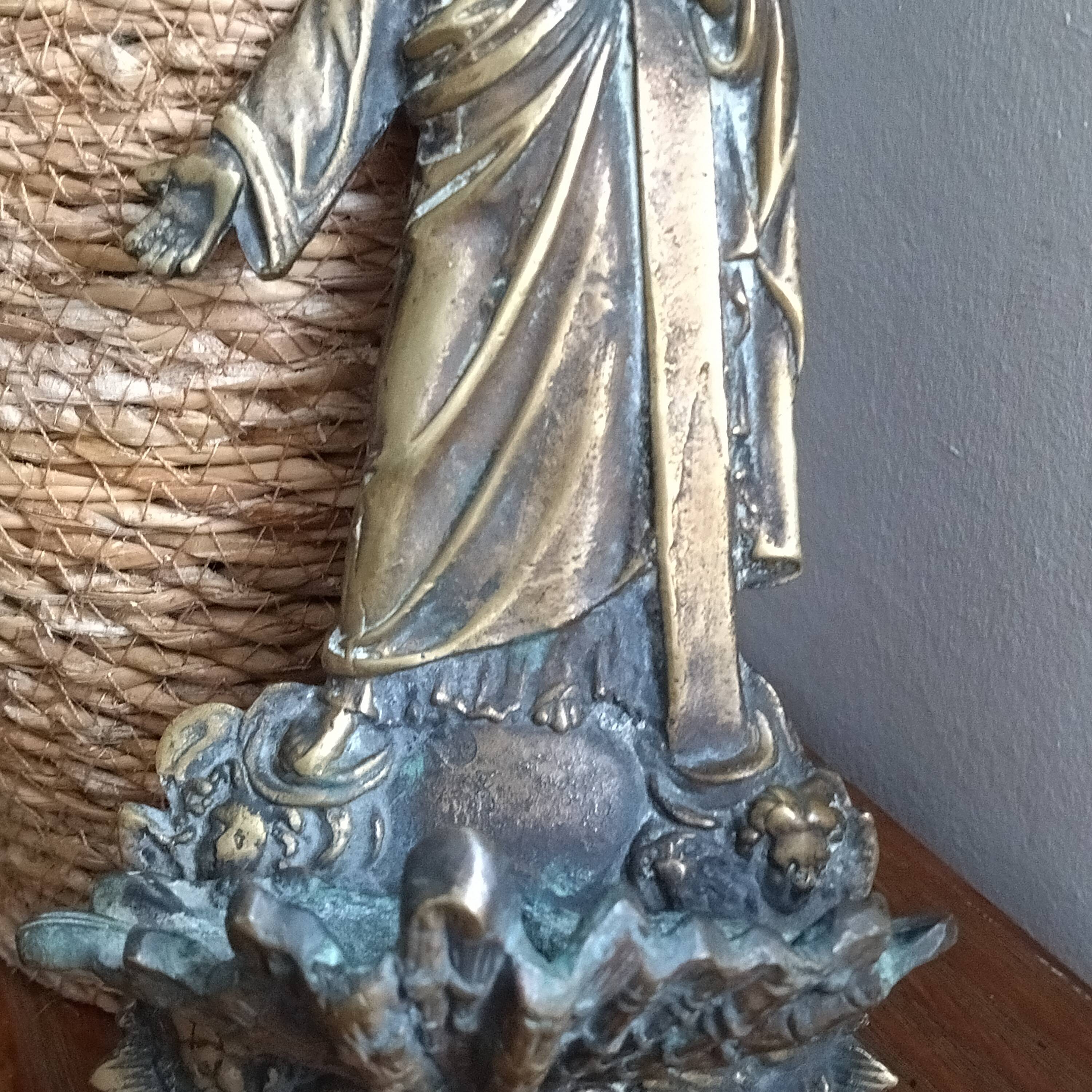 Antique bronze holy water font