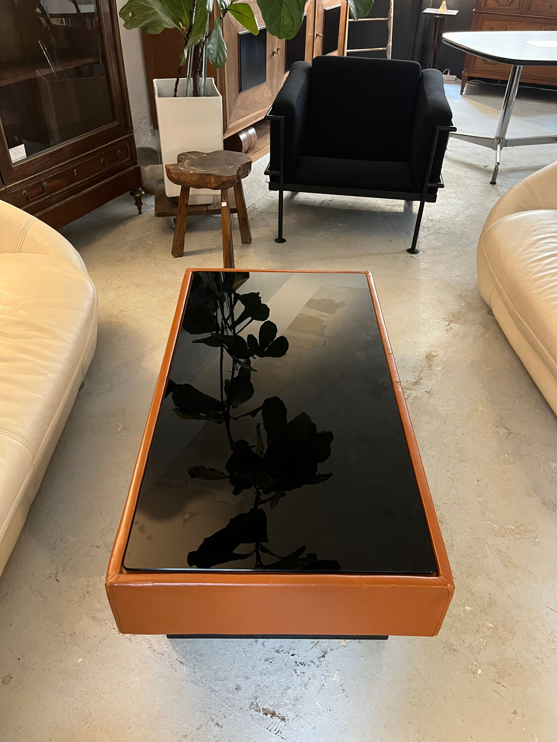 Caramel leather and black glass coffee table