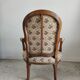 Fauteuil cabriolet de style Louis XVI garniture tapisserie fleurie